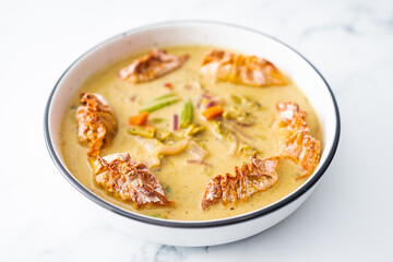 healthy plant-based food, vegetable green curry with vegan wonton dumpling
