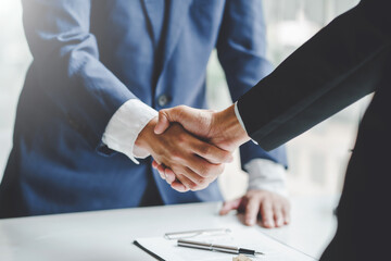 Business people shaking hands to congratulate success. Business executives handshake to congratulate the joint business agreement.