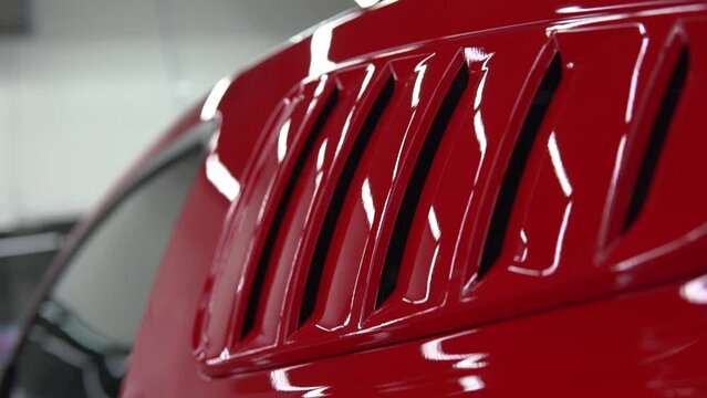 Red, luxury, sport, muscle car body detail. Racing automobile shiny hull side pan.