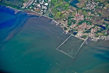Jakarta Bay view from the airplane window that looks crowded and busy
