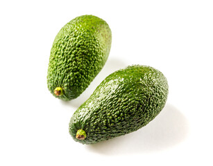 Two avocados isolated on a white background