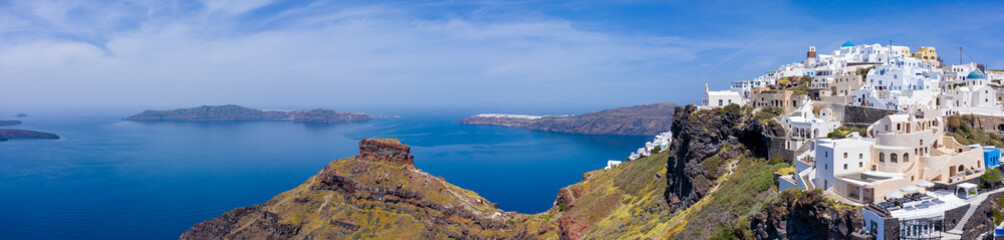 Fira town, with view of caldera, volcano and cruise ships, Santorini, Greece. 