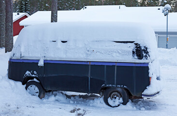 Umea, Norrland Sweden - January 15, 2021: small bus that has been covered in snow