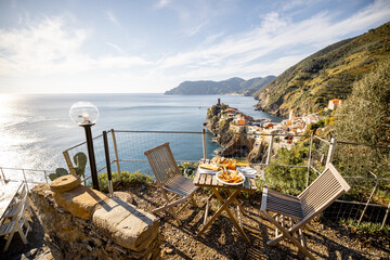 Served lunch table with seafood on coast at Vernazza village in Italy. Concept of mediterranean...