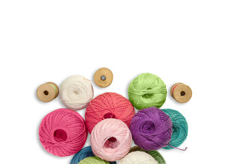 Balls of wool yarn with wooden bobbin with threads on white isolated background. Concept of...