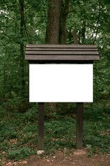 Blank sign on the hiking path in the European forest