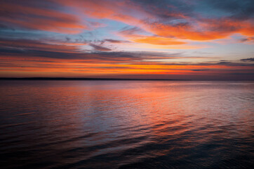 Dramatic sunset sky with clouds. Breathtaking sunset over the sea