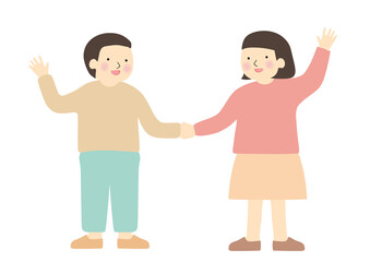 手を繋いで片手をあげて立つ笑顔の子供2人