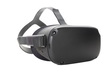 Fototapeta premium Modern virtual reality glasses isolated on a white background. Side view from the front. VR glasses for gaming, entertainment and learning.