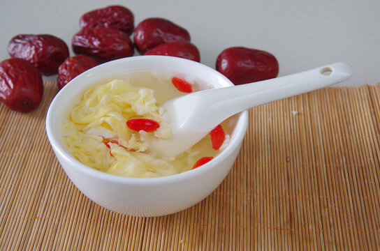 Egg fermented rice wine dessert and white porcelain bowl