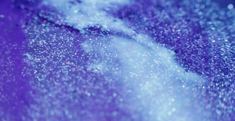 Glitter fluid. Acrylic paint motion. Blue liquid paint flow abstract background shot on RED Cinema camera.
