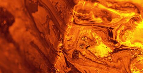 Paint flow. Hot lava effect. Orange fluid motion running downhill shot on RED Cinema camera.