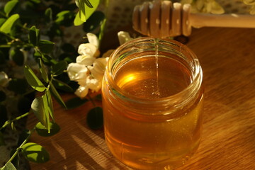 jar of honey with white flowers