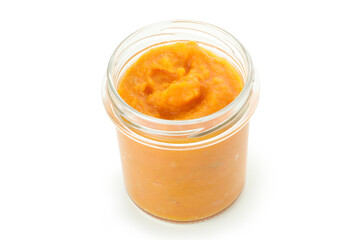Jar of pumpkin jam isolated on white background