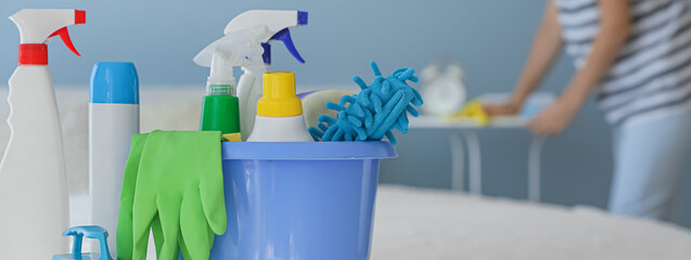 Set of cleaning supplies in bathroom