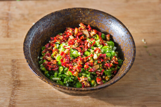 In Japanese ceramic bowl of green chili sauce