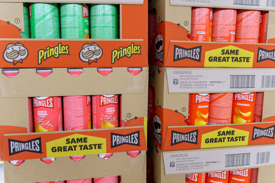 Tyumen, Russia-May 08, 2022: Pringles is a brand of potato snack chips owned by the Kellogg Company. Pringles production with new logo.