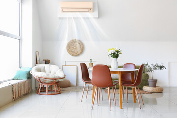 Blowing air conditioner mounted on wall in living room