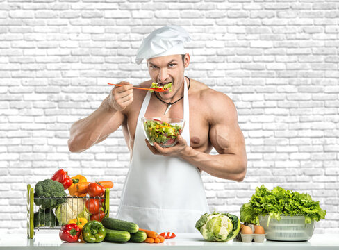 Man Bodybuilder In White Toque Blanche And Cook Protective Apron