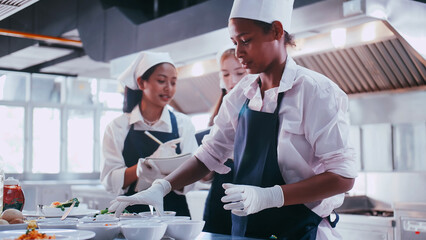 Group of schoolgirls having fun learning to cook. Female students in a cooking class.