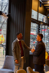 Meeting for the first time while talking and standing  in the cafe