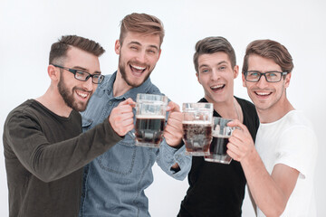 four happy young men, clinking glasses of bee