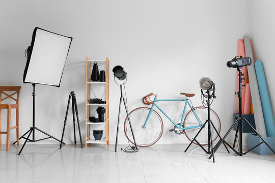 Lighting equipment and bicycle in modern photo studio