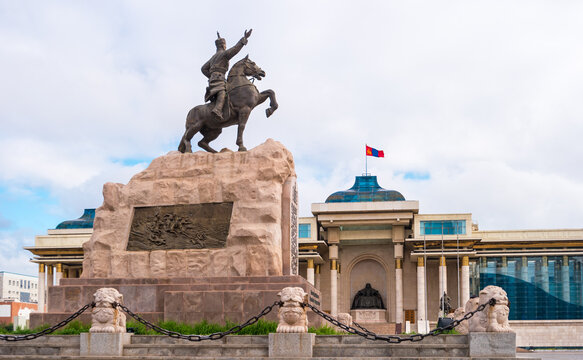 Ulaanbaatar, Mongolia - August 8, 2018: View of the statue of Mongolian revolutionary hero Sukhbaatar and State History Museum of Mongolia with  the statue of Genghis Khan.