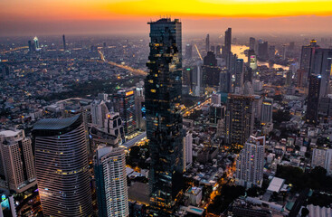 Fototapeta premium Aerial view of King Power Mahanakhon tower in Sathorn Silom central business district of Bangkok, Thailand