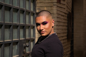 Non-binary person, of South American origin and young, the person is a make-up artist and poses for photos while travel in Europe. Concept equality, homosexuality, gay, lesbian, transgender, gay pride