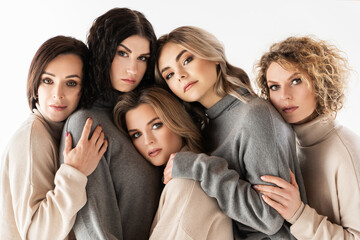 Obraz premium Group of different women wearing turtleneck jumpers on gray background