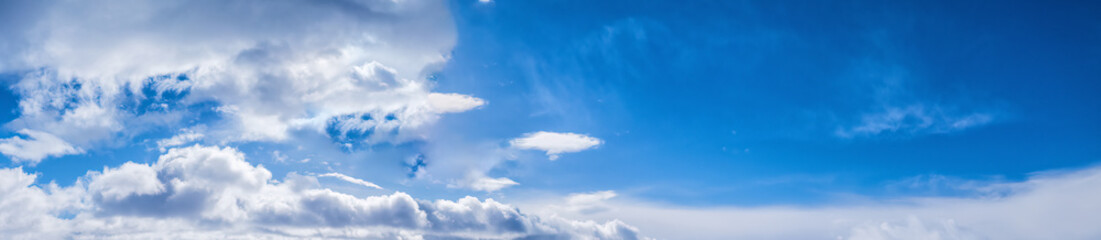 Real wide blue sky background with clouds of northern winter Sweden. panorama