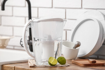 Water filter jug and lime on counter in kitchen