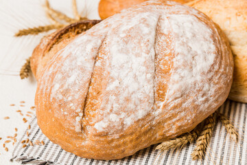 Homemade natural breads. Different kinds of fresh bread as background, perspective view with copy space