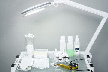Permanent makeup artist workplace with a machine and different equipment