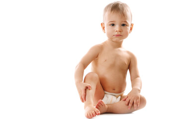 Curious healthy little boy in diaper sitting and looking. - obrazy, fototapety, plakaty