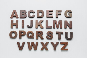 Wooden letters on white background. Alphabet concept - obrazy, fototapety, plakaty