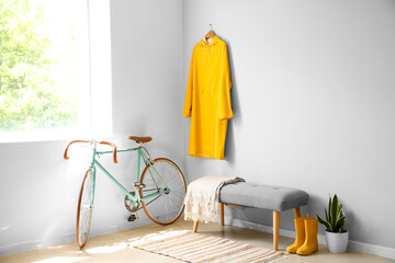 Interior of light hall with soft bench and bicycle