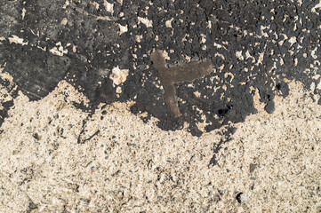 concrete covered with old tar