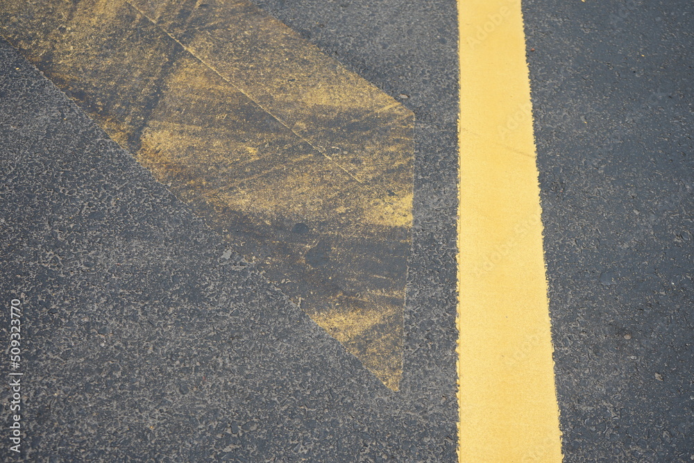 Wall mural Dirty traffic paint from asphalt paving work