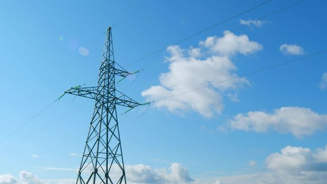 Beautiful clouds on the background of electricity pylons. Ecology concept. Time lapse.