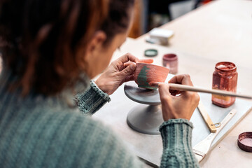 Painting Ceramic Piece in Pottery Class