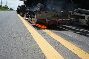 Road maintenance work With heavy machinery by HOT MIX IN - PLACE RECYCLING method