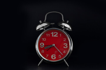 Alarm clock on black background concept for insomnia