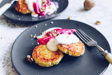 Cottage cheese pancakes served with poached rhubarb