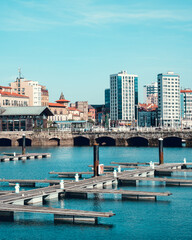 View of the seaport of gijon and its buildings