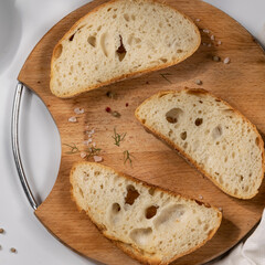 Slices of wholemeal bread in empty plates, dieting, poverty concept