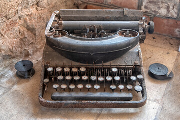 German Enigma machine, an old and rusty retro typewriter. 
Enigma - a retro typewriter from the Second World War.
