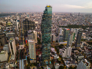 Fototapeta premium Aerial view of King Power Mahanakhon tower in Sathorn Silom central business district of Bangkok, Thailand