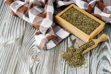 fragrant dried thyme on a wooden rustic background